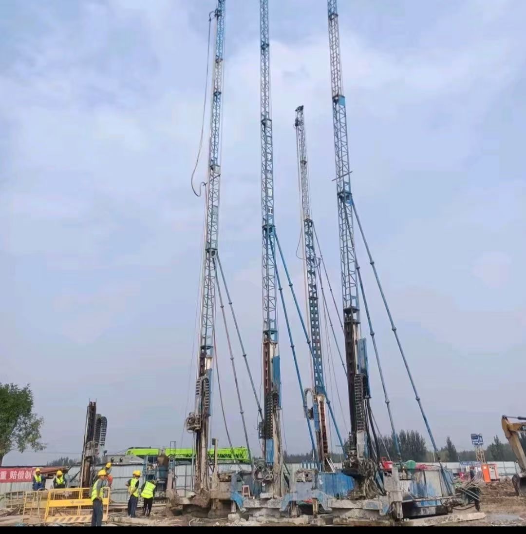 Jet grouting crew and rigs on a daytime site